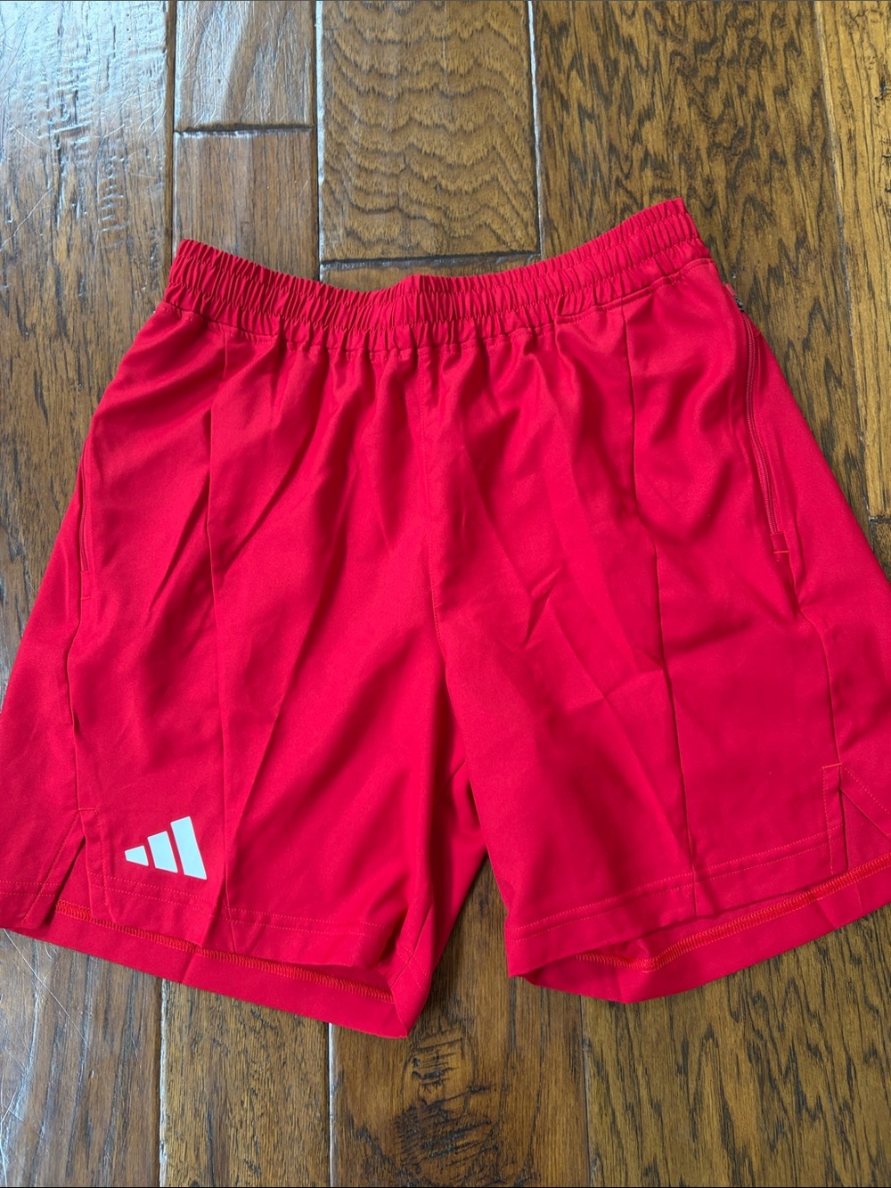 Men’s adidas Bright Red Athletic Shorts with Elastic Waist. Zipper pockets